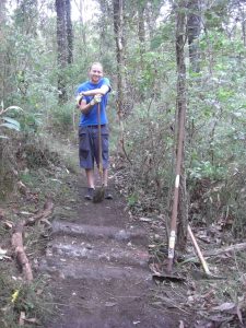 The log roll over I helped make, honestly is it there... right next to the rake. Photo of me at the GCTA trail care day - April 2012